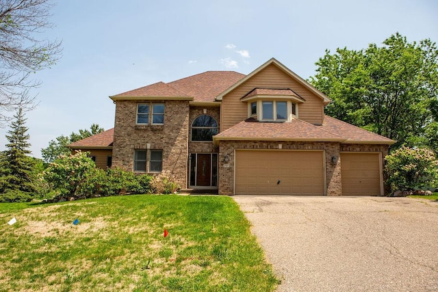 2505 Christian Dr, Chaska, MN 55318 - traditional-style house with asphalt driveway, a front yard, roof with shingles, an attached garage, and brick siding