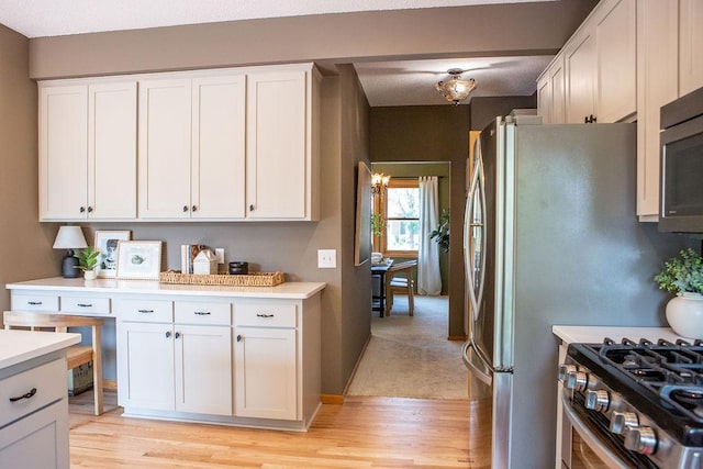 2505 Christian Dr, Chaska, MN 55318 - kitchen with light countertops, light wood-style flooring, and white cabinetry