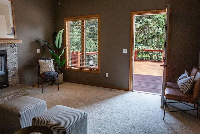 2505 Christian Dr, Chaska, MN 55318 - living area with carpet flooring, healthy amount of natural light, and a stone fireplace