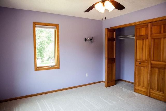 2505 Christian Dr, Chaska, MN 55318 - unfurnished bedroom featuring light colored carpet, baseboards, a closet, and a ceiling fan