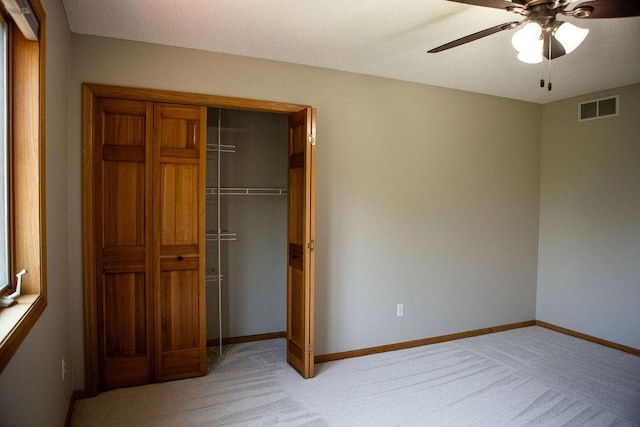 2505 Christian Dr, Chaska, MN 55318 - unfurnished bedroom featuring light colored carpet, baseboards, a closet, and a ceiling fan