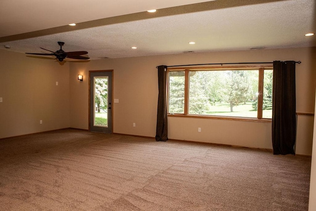 2505 Christian Dr, Chaska, MN 55318 - empty room with light colored carpet, healthy amount of natural light, recessed lighting, a textured ceiling, and a ceiling fan