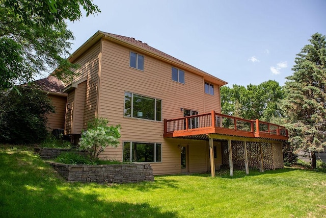 2505 Christian Dr, Chaska, MN 55318 - rear view of house with a deck and a lawn