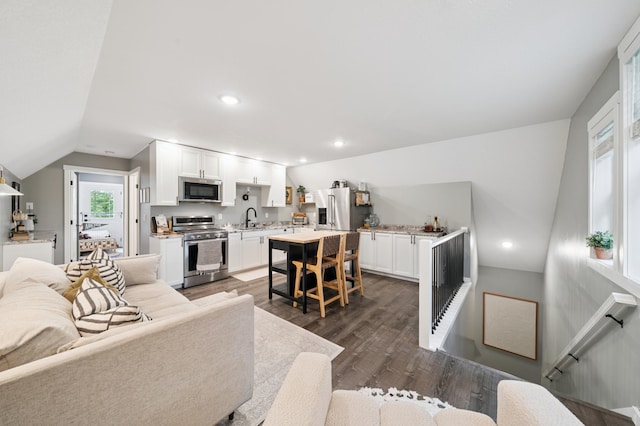 2293 57th Ave, East Farmington, WI 54020 - living area featuring vaulted ceiling, dark wood finished floors, and recessed lighting