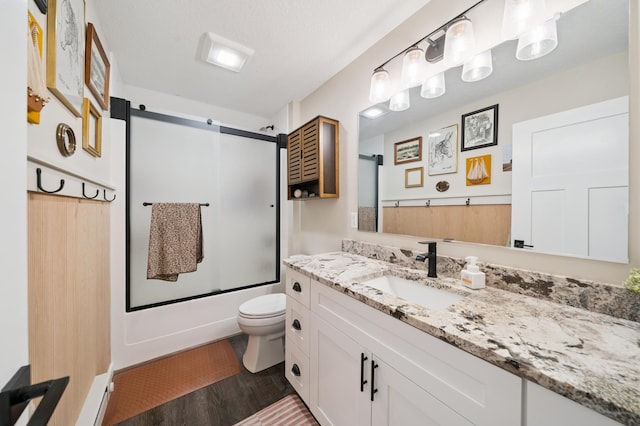 2293 57th Ave, East Farmington, WI 54020 - full bathroom featuring vanity, bath / shower combo with glass door, and wood finished floors