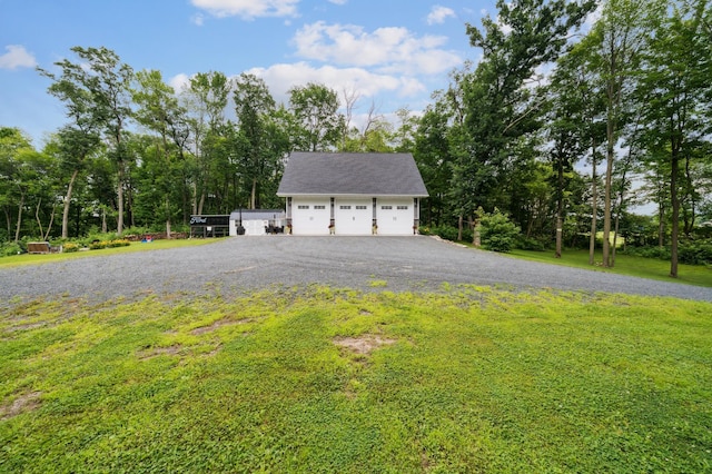 2293 57th Ave, East Farmington, WI 54020 - view of home's exterior with a detached garage and a lawn