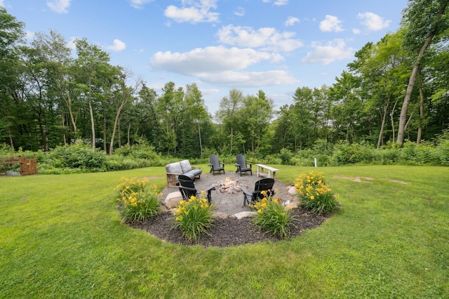 2293 57th Ave, East Farmington, WI 54020 - view of grassy yard with a patio area and an outdoor fire pit