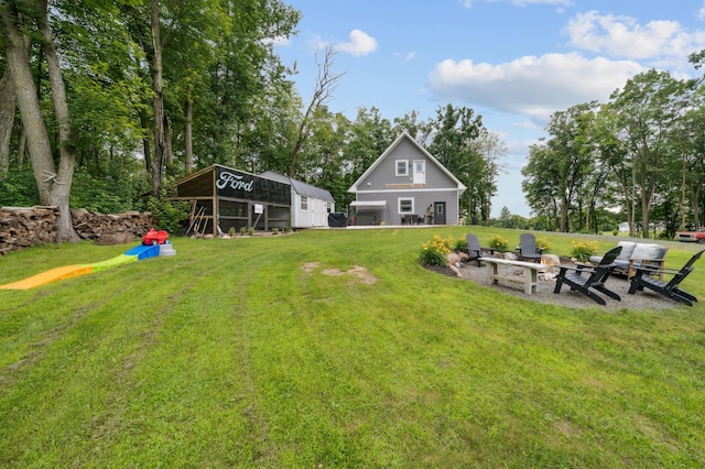 2293 57th Ave, East Farmington, WI 54020 - view of green lawn featuring an outdoor fire pit