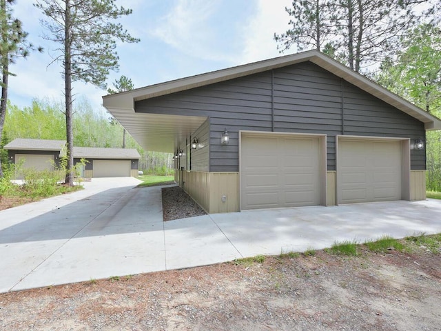 33272 Big Pine Trl, Grand Rapids, MN 55744 - view of front of house featuring an outdoor structure and a detached garage