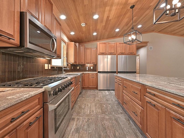 33272 Big Pine Trl, Grand Rapids, MN 55744 - kitchen featuring stainless steel appliances, lofted ceiling, wooden ceiling, tasteful backsplash, and light stone counters