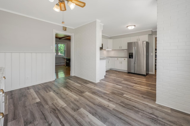 30105 Olinda Trl, Lindstrom, MN 55045 - kitchen featuring stainless steel refrigerator with ice dispenser, ceiling fan, wood finished floors, light countertops, and white cabinetry