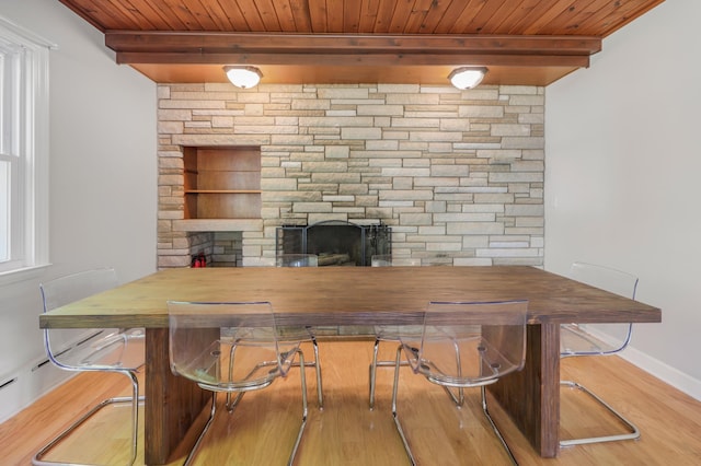 30105 Olinda Trl, Lindstrom, MN 55045 - bar with wood ceiling, a stone fireplace, wood finished floors, beam ceiling, and baseboards
