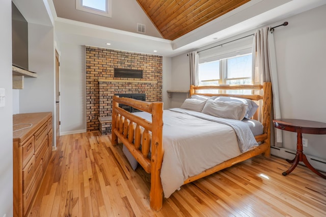 30105 Olinda Trl, Lindstrom, MN 55045 - bedroom featuring light wood-style floors, wood ceiling, a fireplace, and high vaulted ceiling