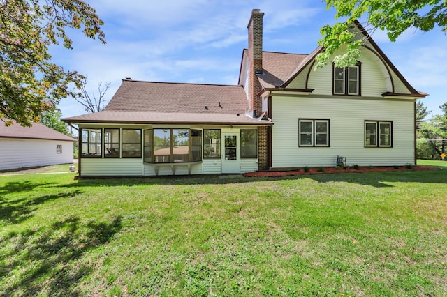 30105 Olinda Trl, Lindstrom, MN 55045 - rear view of house with a sunroom, a lawn, and a chimney