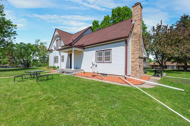 30105 Olinda Trl, Lindstrom, MN 55045 - view of front facade with a chimney, a front lawn, and roof with shingles
