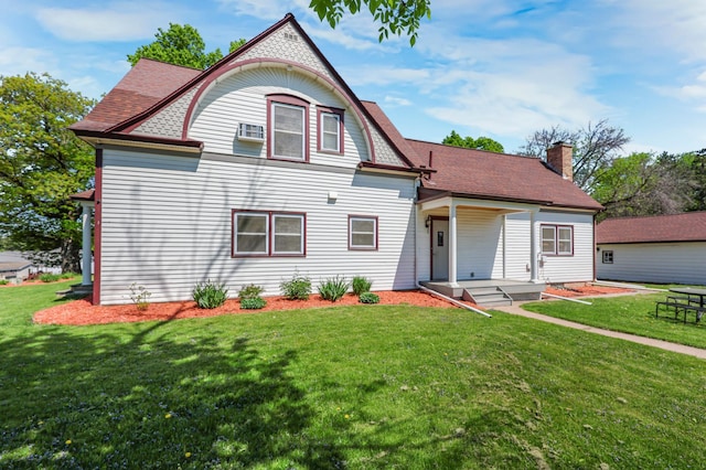 30105 Olinda Trl, Lindstrom, MN 55045 - victorian-style house with a front yard, a shingled roof, a chimney, and an AC wall unit