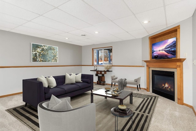 409 5th St NW, Saint Michael, MN 55376 - carpeted living room featuring baseboards, a drop ceiling, recessed lighting, and a glass covered fireplace