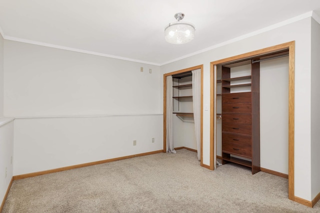 409 5th St NW, Saint Michael, MN 55376 - unfurnished bedroom with carpet flooring, crown molding, baseboards, and two closets