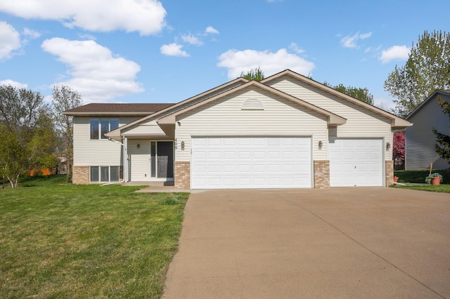 409 5th St NW, Saint Michael, MN 55376 - view of front of home with brick siding, driveway, a garage, and a front yard