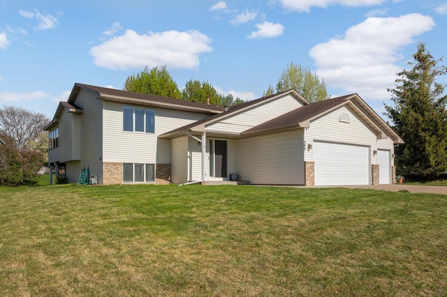 409 5th St NW, Saint Michael, MN 55376 - tri-level home with a garage, brick siding, driveway, and a front yard