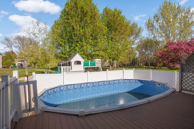 409 5th St NW, Saint Michael, MN 55376 - view of pool featuring a wooden deck and fence