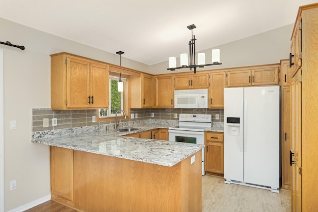 409 5th St NW, Saint Michael, MN 55376 - kitchen featuring white appliances, a sink, a peninsula, light wood-style floors, and a chandelier