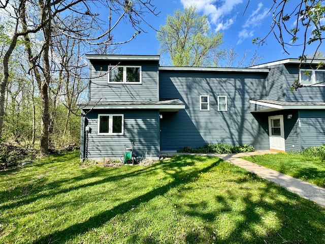 37489 Elm Dr Unit A, Warroad, MN 56763 - rear view of house with a lawn