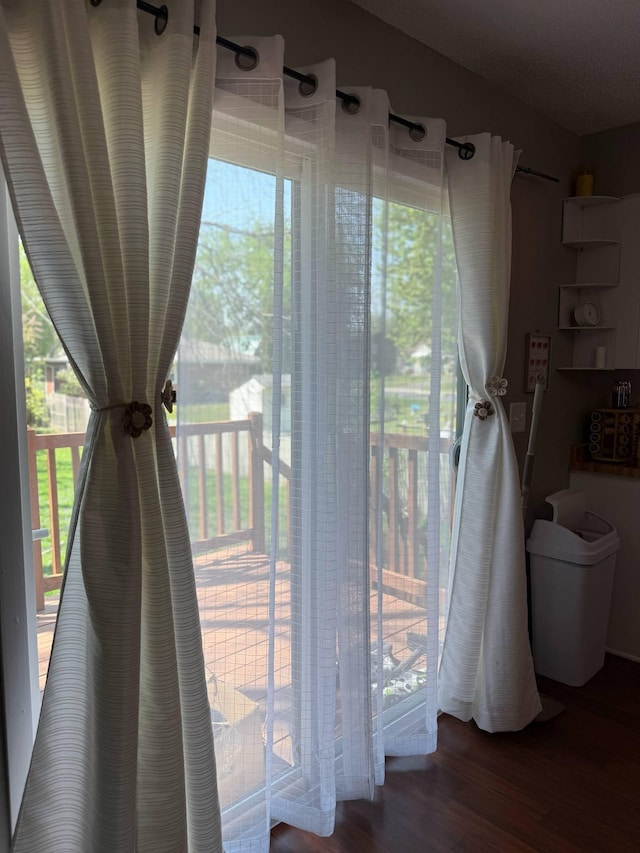 doorway to outside with wood finished floors