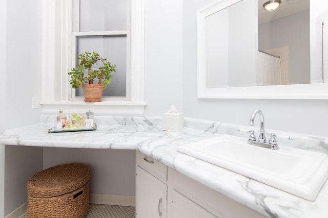 full bath with vanity and tile patterned flooring