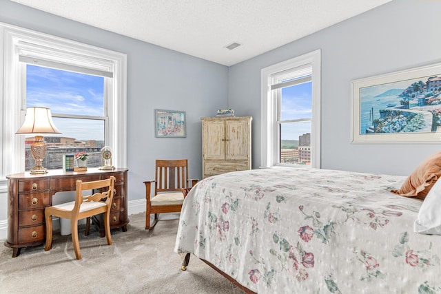 bedroom with carpet flooring and baseboards
