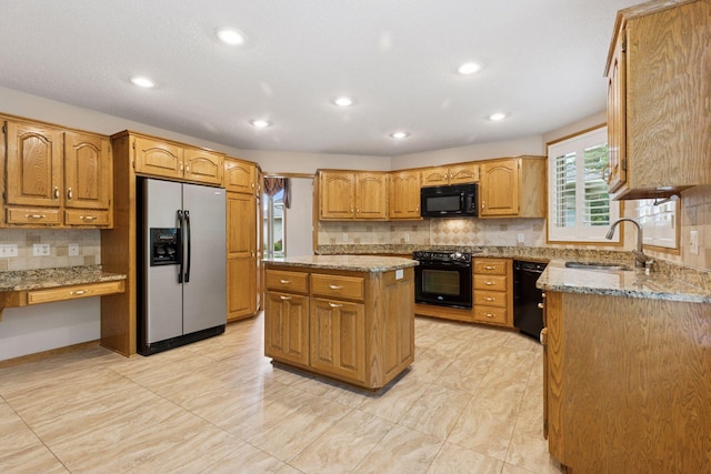 12124 Bluebird Cir NW, Coon Rapids, MN 55448 - kitchen with black appliances, a sink, light stone countertops, backsplash, and recessed lighting