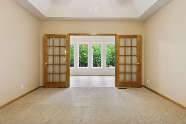 12124 Bluebird Cir NW, Coon Rapids, MN 55448 - unfurnished room with carpet, vaulted ceiling, french doors, and baseboards