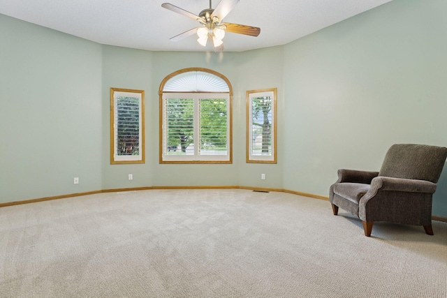 12124 Bluebird Cir NW, Coon Rapids, MN 55448 - sitting room with carpet, a ceiling fan, and baseboards