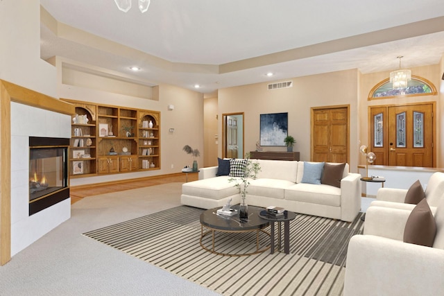 12124 Bluebird Cir NW, Coon Rapids, MN 55448 - carpeted living area with recessed lighting, a chandelier, and a tile fireplace