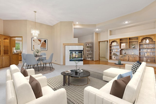 12124 Bluebird Cir NW, Coon Rapids, MN 55448 - living room featuring a chandelier, recessed lighting, a tile fireplace, and vaulted ceiling