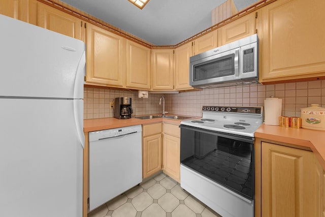 5440 Three Points Blvd Unit 536, Mound, MN 55364 - kitchen featuring white appliances, a sink, light brown cabinetry, and light countertops