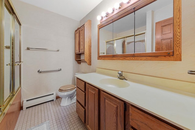 5440 Three Points Blvd Unit 536, Mound, MN 55364 - bathroom featuring a baseboard heating unit, toilet, vanity, shower / bath combination with glass door, and tile patterned floors