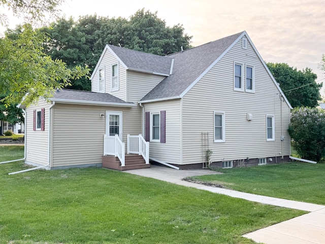 404 5th Ave, Wilmont, MN 56185 - rear view of house featuring roof with shingles and a lawn