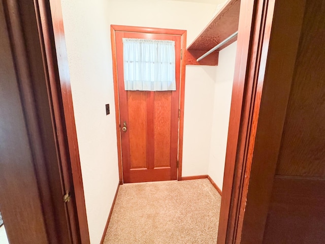 404 5th Ave, Wilmont, MN 56185 - doorway to outside with carpet and baseboards