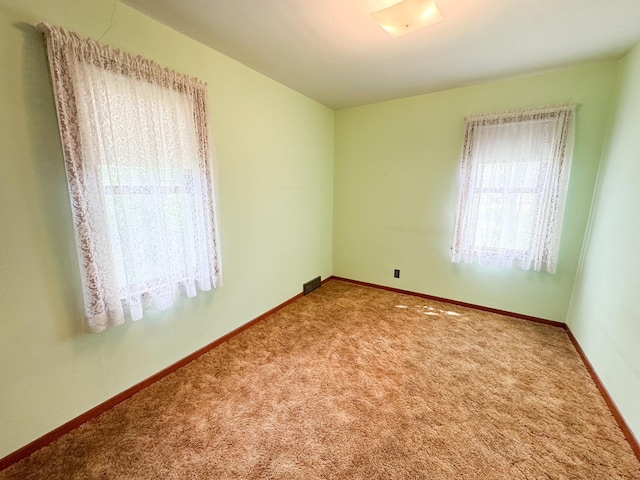404 5th Ave, Wilmont, MN 56185 - carpeted empty room featuring baseboards
