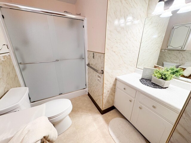 404 5th Ave, Wilmont, MN 56185 - full bath with toilet, vanity, a stall shower, wainscoting, and tile patterned flooring