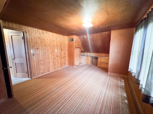 404 5th Ave, Wilmont, MN 56185 - additional living space with carpet, wooden walls, and baseboards