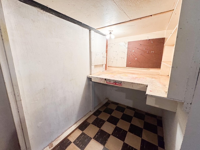 404 5th Ave, Wilmont, MN 56185 - bathroom with tile patterned floors and a workshop area