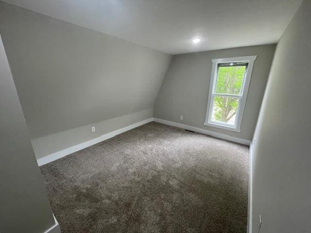unfurnished room with carpet, baseboards, vaulted ceiling, and recessed lighting