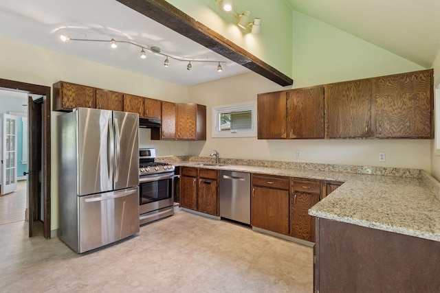 1125 James Ave, Saint Paul, MN 55105 - kitchen featuring appliances with stainless steel finishes, a sink, light floors, under cabinet range hood, and light stone counters