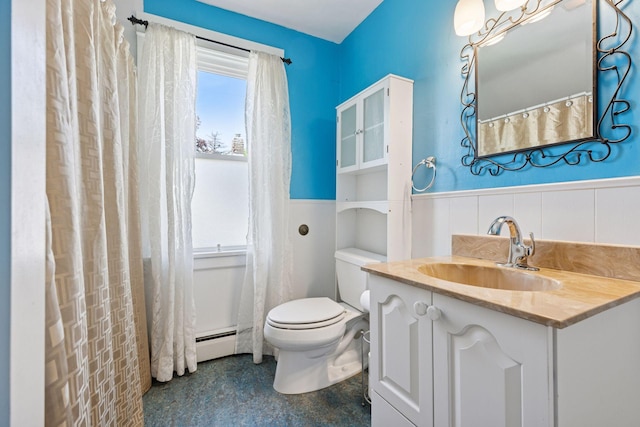 1125 James Ave, Saint Paul, MN 55105 - full bathroom with vanity, toilet, a wainscoted wall, and baseboard heating