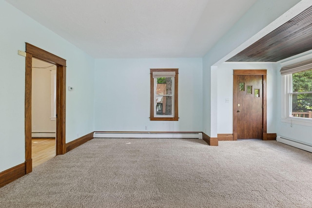 1125 James Ave, Saint Paul, MN 55105 - empty room featuring carpet floors, a baseboard heating unit, a baseboard radiator, and baseboards
