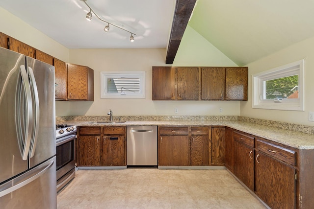 1125 James Ave, Saint Paul, MN 55105 - kitchen with appliances with stainless steel finishes, a sink, light floors, light stone countertops, and lofted ceiling
