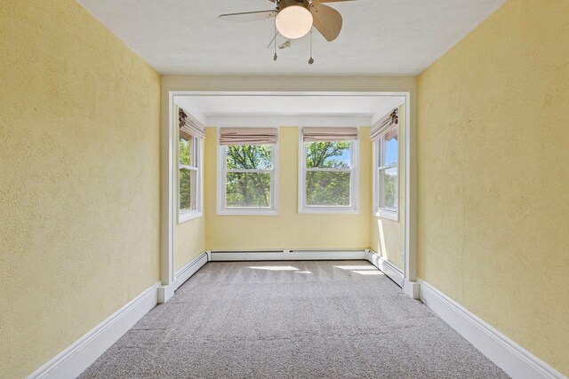 1125 James Ave, Saint Paul, MN 55105 - spare room with a textured wall, carpet floors, ceiling fan, a baseboard radiator, and baseboards