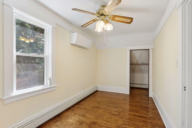 1125 James Ave, Saint Paul, MN 55105 - unfurnished bedroom featuring a baseboard radiator, wood finished floors, a wall unit AC, and baseboards
